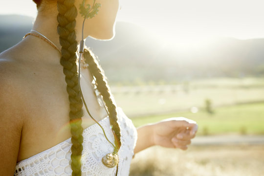 Close up of young woman with braids