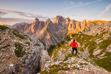Fototapeta na wymiar mountaineer in front of the tops Cadini di Misurina range in National Park Tre Cime di Lavaredo