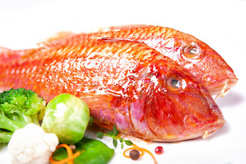Two red mullets and vegetables