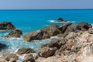 Seascape of blue waters and rocks of Megali Petra Beach, Lefkada, Ionian Islands, Greece