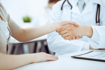 Fototapeta na wymiar Partnership, trust og doctor and patient, medical ethics concept. Handshake in medicine