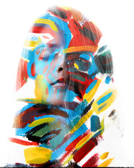 Paintography. Double exposure. Close up of an attractive peaceful model combined with colorful hand...