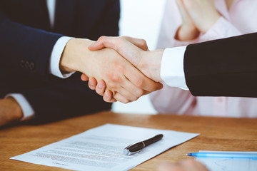 Business people shaking hands finishing up a meeting. Handshake at successful negotiation