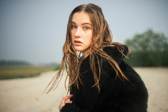 close up of a woman in a fur coat