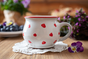 Polka dot mug with flowers and blueberries