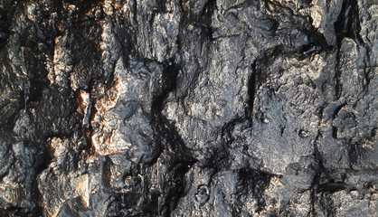 Dark background with contrasting divorces. Stone base.