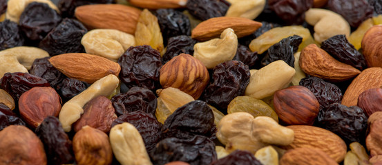 Fruits and nuts. Cashews, almonds, hazelnuts and raisins. Close-up.