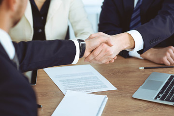 Business people shaking hands at meeting or negotiation in the office. Handshake concept. Partners are satisfied because signing contract