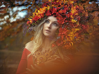 Portrait of a pretty forest nymph wearing an outstanding chaplet