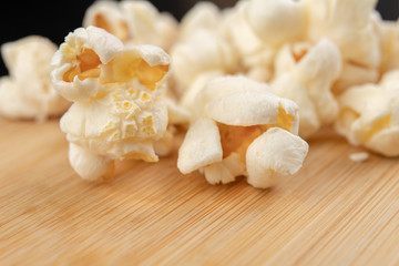 Popcorn on the kitchen table. Delicious roasted corn kernels.