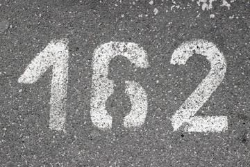 Parking lot asphalt number 162 stencil street sidewalk