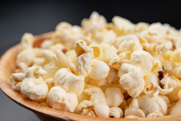 Popcorn on the kitchen table. Delicious roasted corn kernels.
