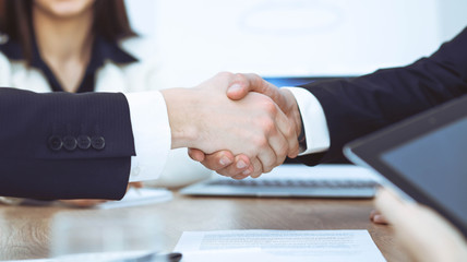 Business people shaking hands at meeting or negotiation in the office. Handshake concept. Partners are satisfied because signing contract