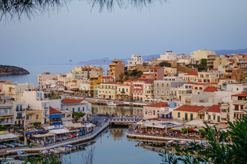 Fototapeta na wymiar Evening view to the Agios Nikolaos harbour from the top