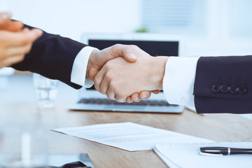 Business people shaking hands at meeting or negotiation in the office. Handshake concept. Partners are satisfied because signing contract