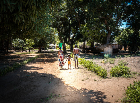 African Family With A Little Kid Walking Around The Village. Nosy-be, Madagascar (africa)