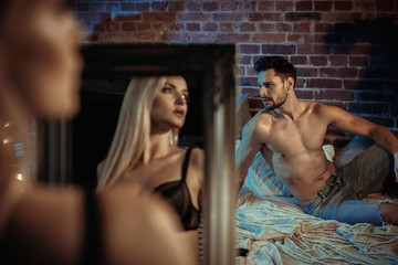 Sensual couple relaxing in a modern, stylish apartment