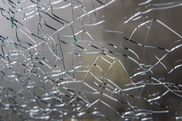 Broken glass. Web of cracks. Abstract background