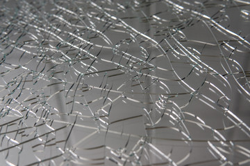 Broken glass. Web of cracks. Abstract background