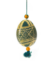 traditional color Easter egg decorated with handmade patterns, isolated on white background