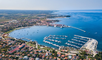 Umag is a coastal city in Istria, Croatia. The city hosts a yearly ATP tennis tournament on clay courts. - obrazy, fototapety, plakaty
