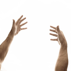 Two male hands on an empty background