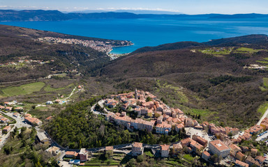 Aerial shot of the Croatian town Labin with a beautiful  background featuring the port of Rabac - obrazy, fototapety, plakaty