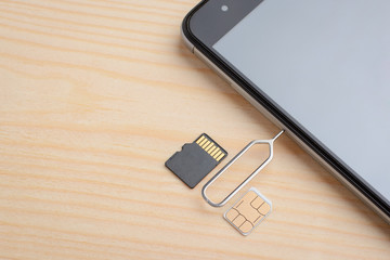 Opening slot for SIM card and micro SD memory card in a modern smartphone using special clip