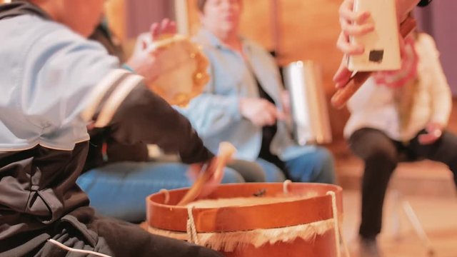 Music classroom practicing with percussions instruments. Child practicing on drum. 4k
