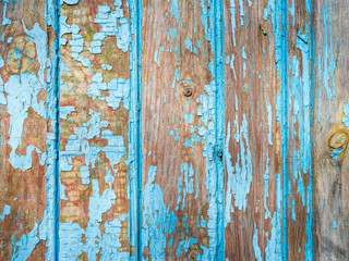 old painted planks in blue paint in vertical view