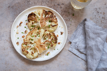 Vegetarian roasted cauliflower steak with pine nuts