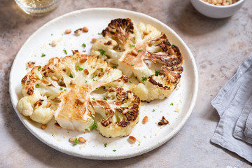 Vegetarian roasted cauliflower steak with pine nuts