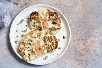 Vegetarian roasted cauliflower steak with pine nuts