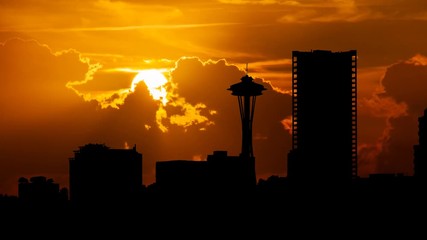 Seattle: Silhouette of Downtown Skyline at Sunset with Red Sun and Clouds in Time Lapse, Washington, USA