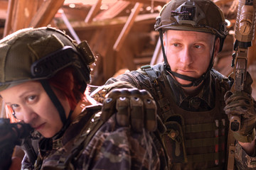 Male and female airsoft shooters