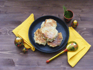 Traditional russian cuisine : pancakes  with oak flakes on cast iron and nesting dolls matreshka...