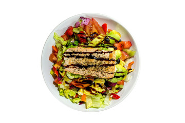 Isolated healthy food, grill salmon steak and mix colourful salad with vegetables and fruits on white plate and white background.