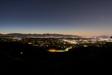 Before dawn view of the San Fernando Valley with San Gabriel Mountains in background in Los Angeles, California.