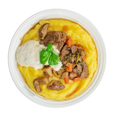 Beef stroganoff with mushrooms over polenta above isolated on white