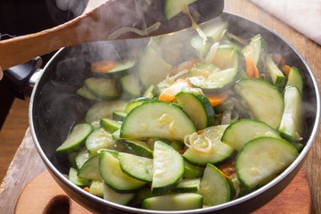 Chicken. carrot and zucchini on pan vegetable food,  paprika.