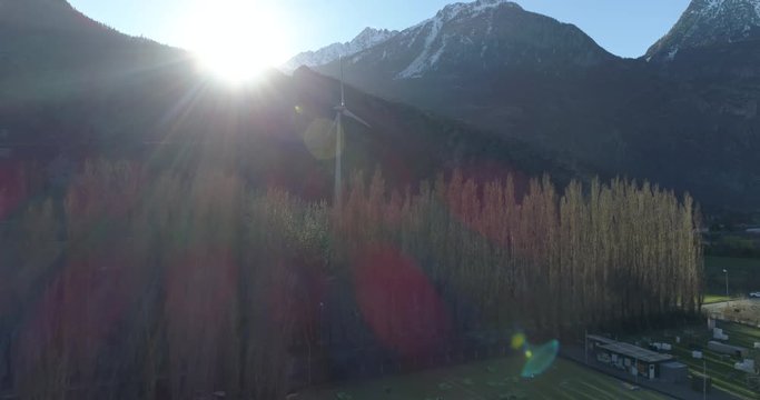 Windmill shadow on trees, approach, Vernayaz - Aerial 4K