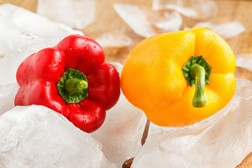 Yellow and red bell pepper with ice