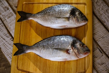 Fish seafood dorado, raw food,  cook background.