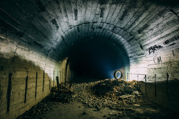 Underground concrete tunnel or corridor of abandoned nuclear bunker or shelter or basement