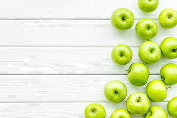 summer fruit pattern with apples on light wooden background top view copyspace