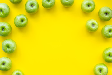 summer fruit pattern with apples on yellow background top view copyspace