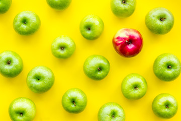green apples for organic summer food pattern on yellow background top view