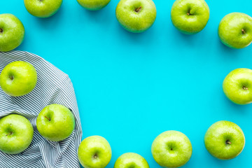 summer fruit pattern with apples on blue colorful background top view copyspace