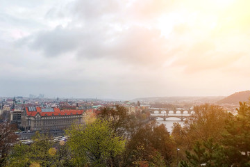 Old stone bridges over the river in Prague. Panorama of the city from a high point
