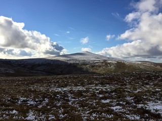 The snow covered Snaefell Mountain in the Isle of Man. Snaefell is the highest mountain and the only summit higher than 2,000 feet on the Isle of Man, at 2,037 feet above sea level.